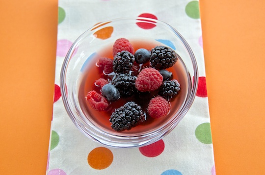 Berries with cava-honey syrup